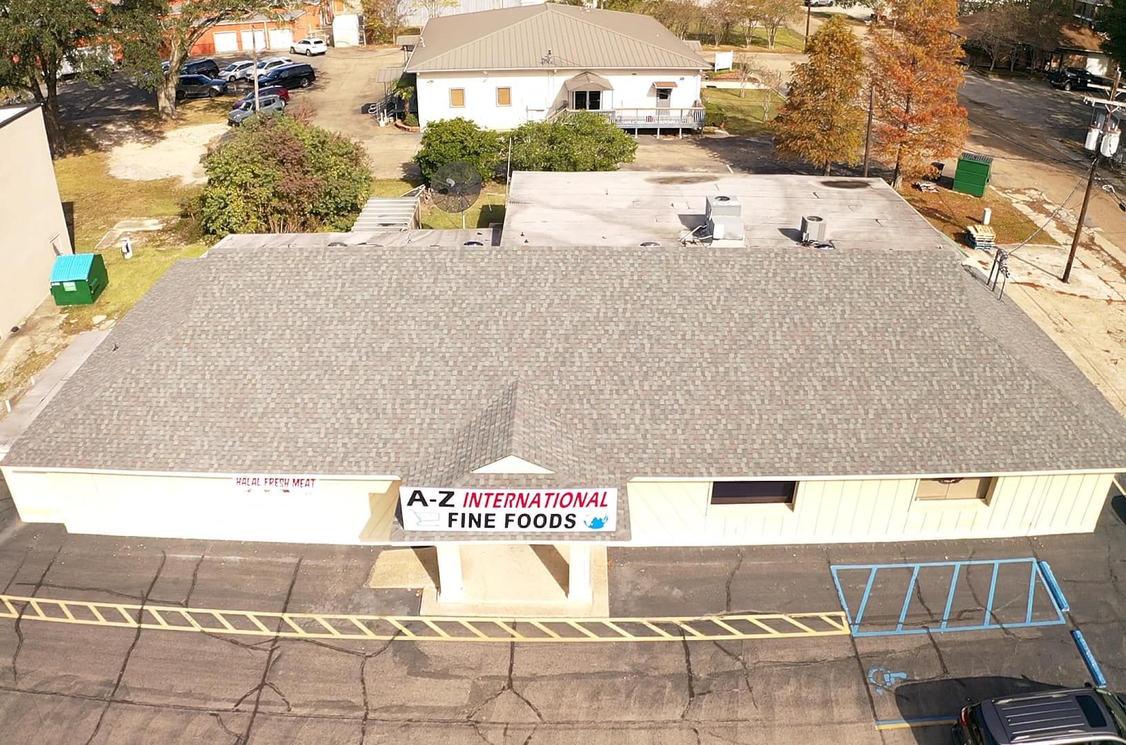 An aerial view of a building with a sign that says a-z international fine foods