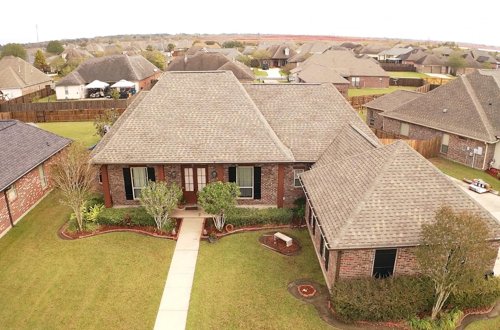 An aerial view of a house in a residential area