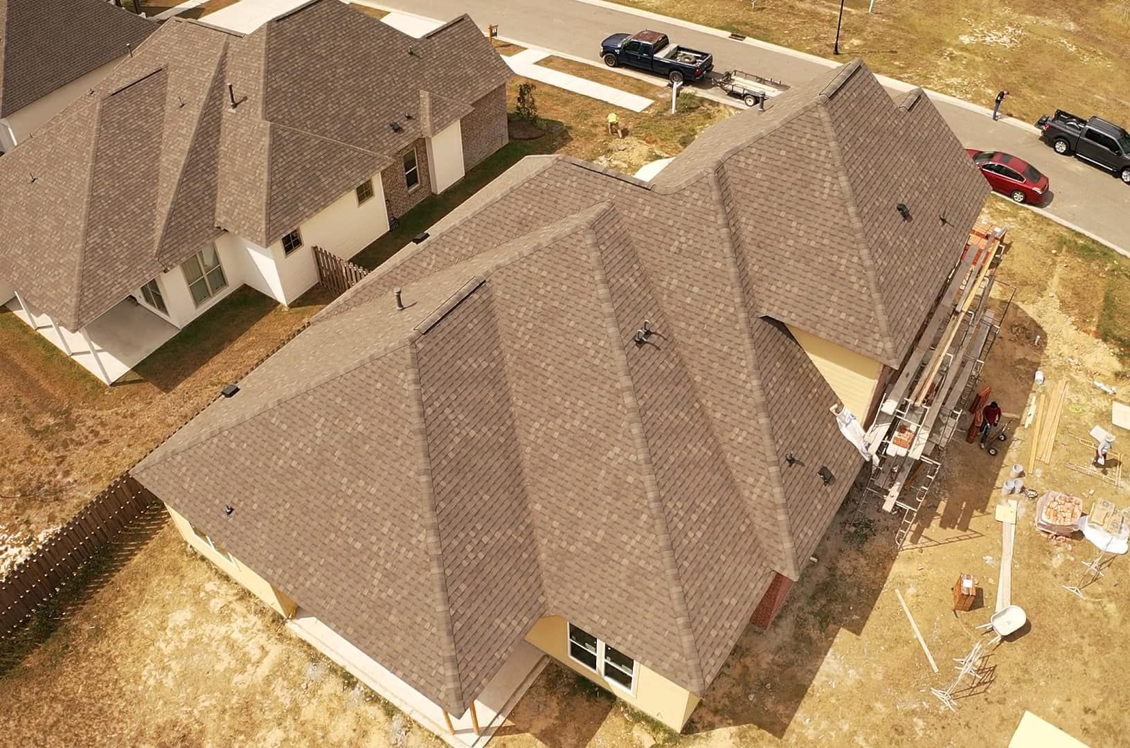 An aerial view of a row of houses under construction