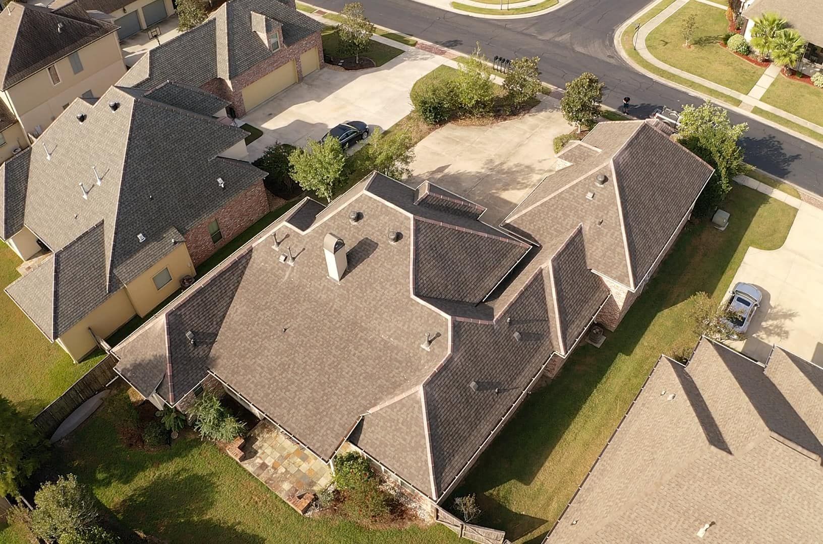 An aerial view of a residential area with a lot of houses