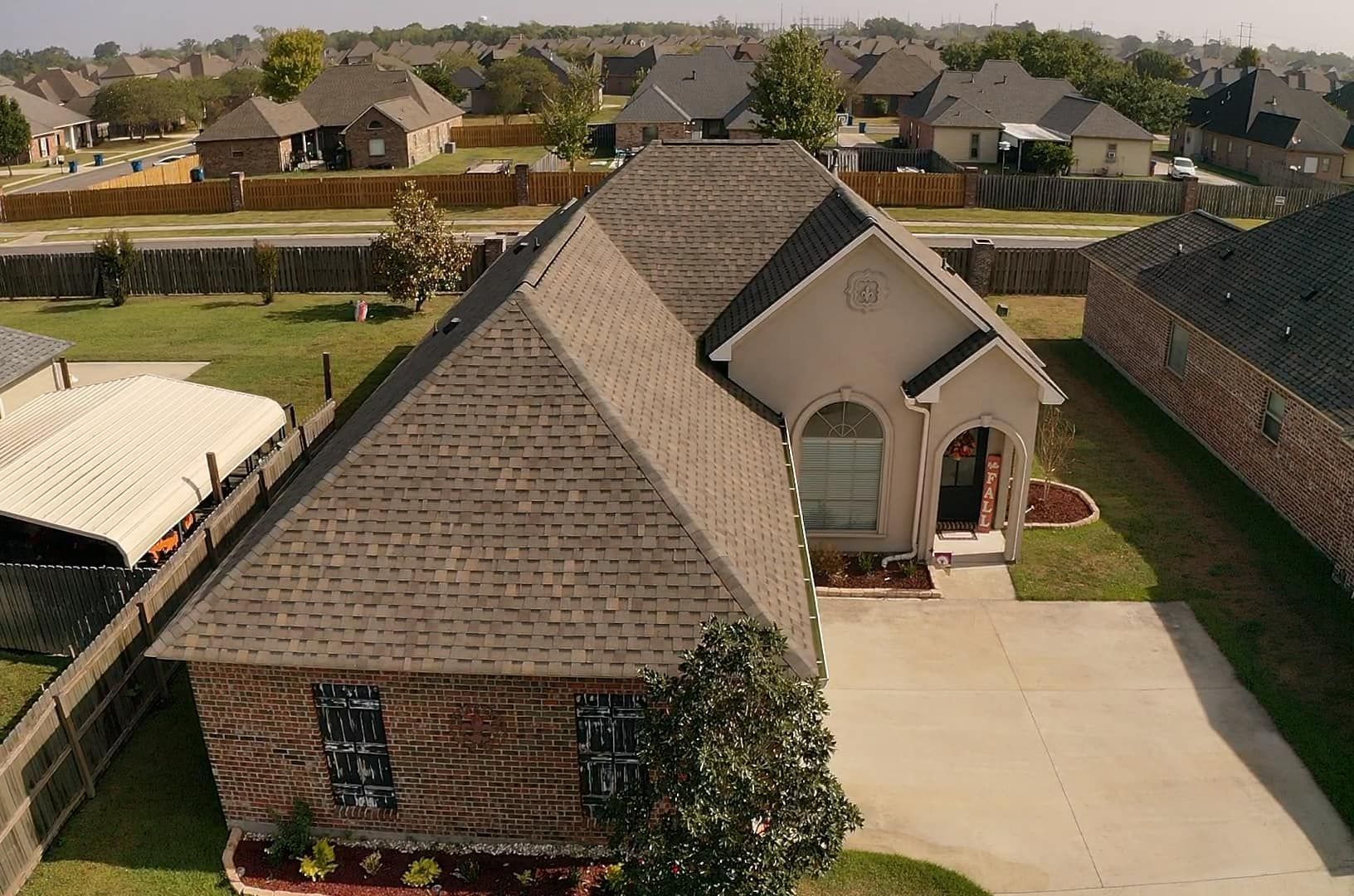 An aerial view of a house in a residential area