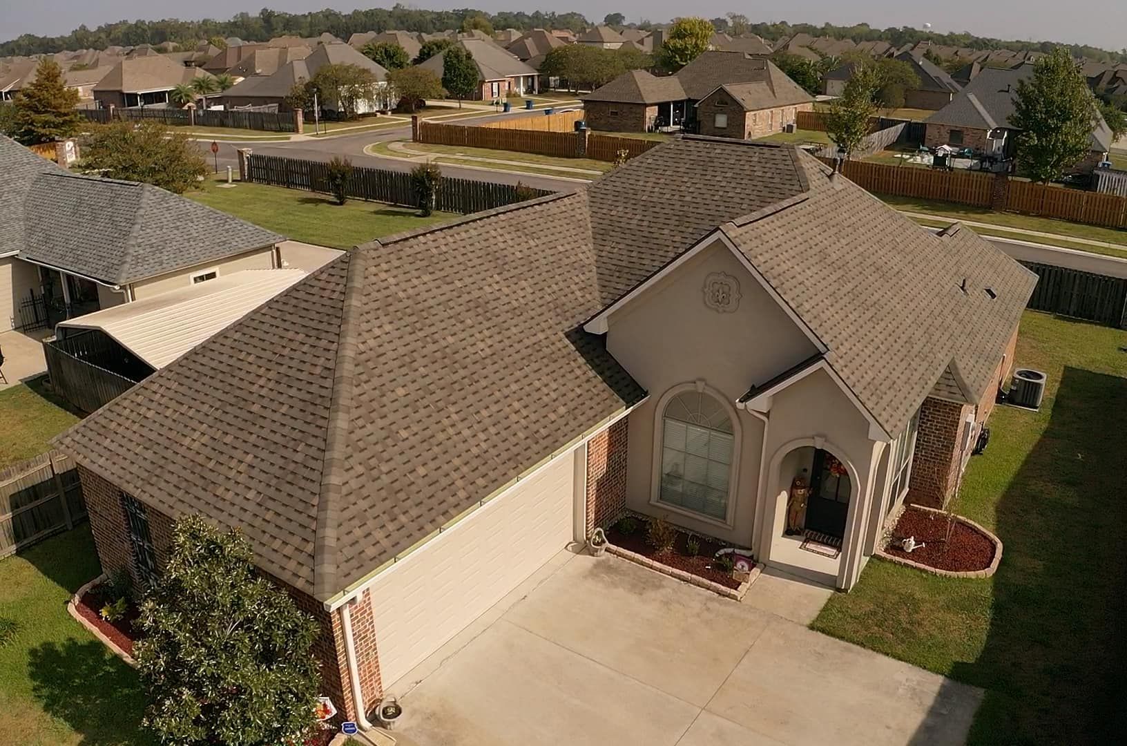 An aerial view of a house with a new roof