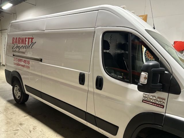 A white van with the word Barnett on it