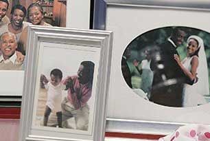 Framed photos: father with child, wedding couple, family portrait.