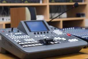 Control panel with a screen, buttons, and microphone.