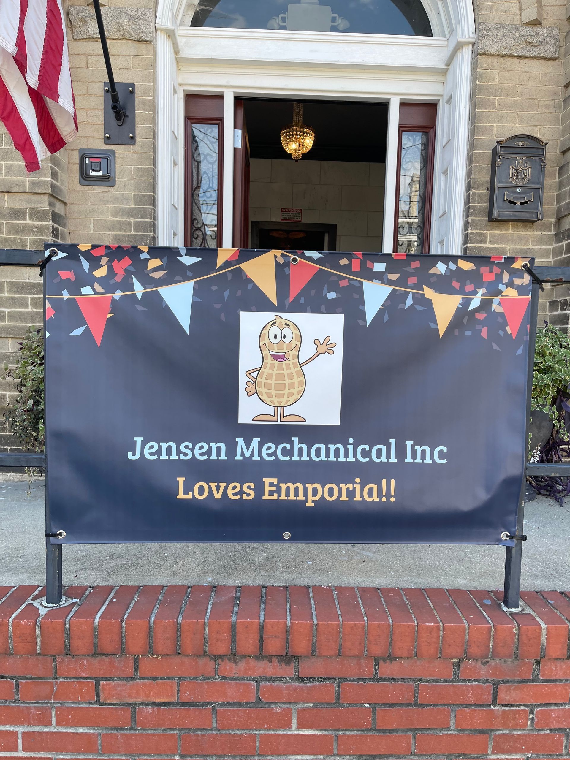 A banner outside a building reads 