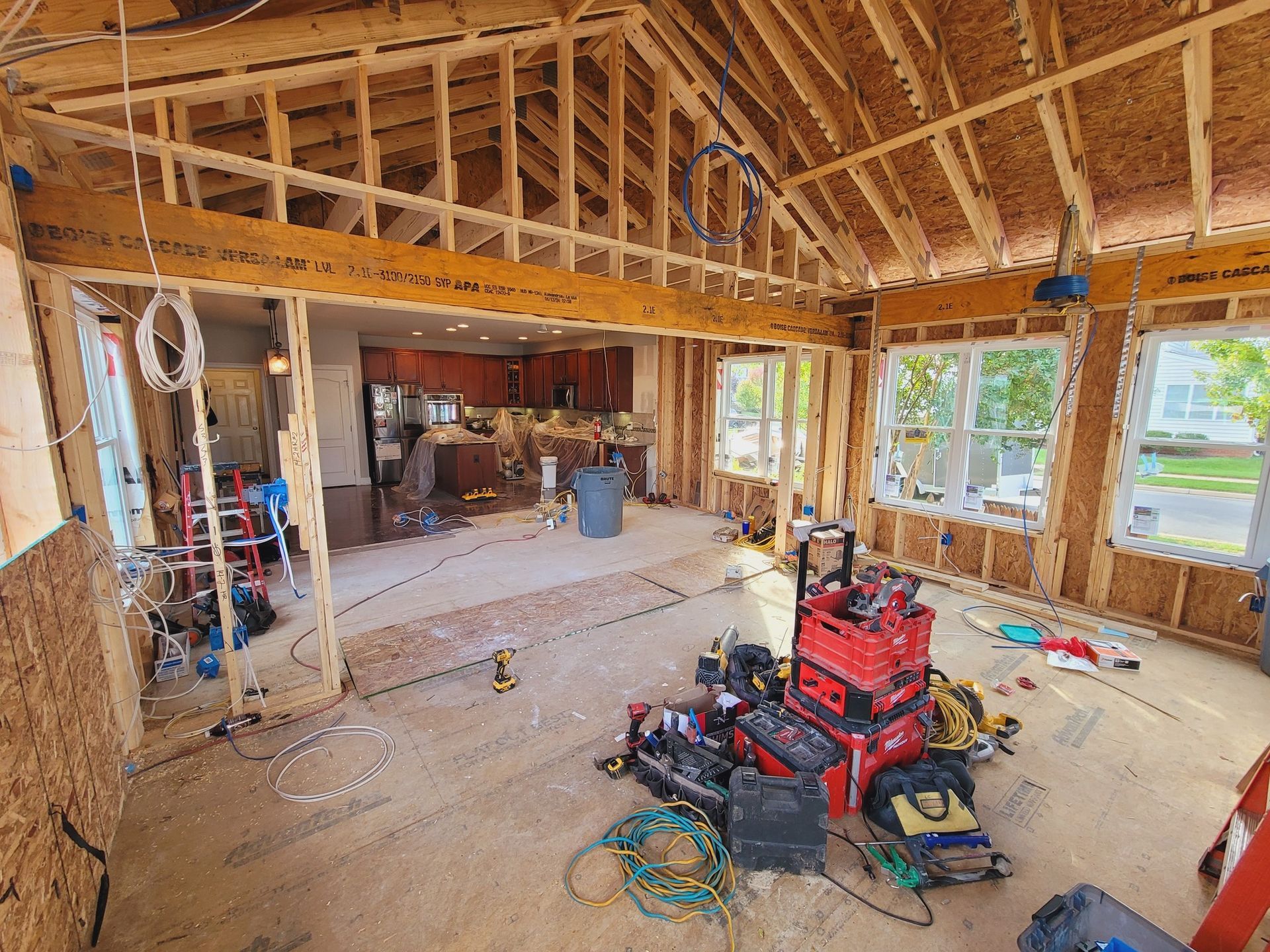 A room under construction with a lot of tools on the floor.