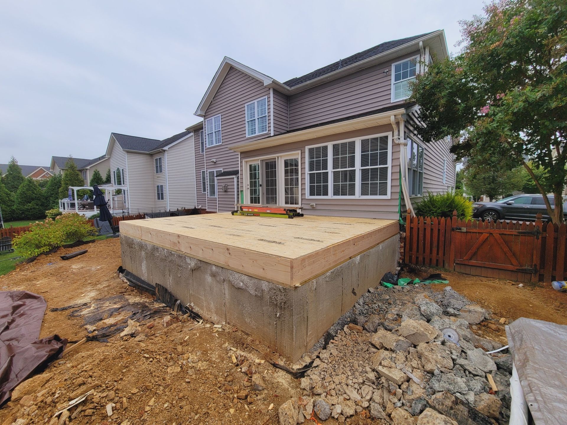 A house is being built on top of a dirt field.