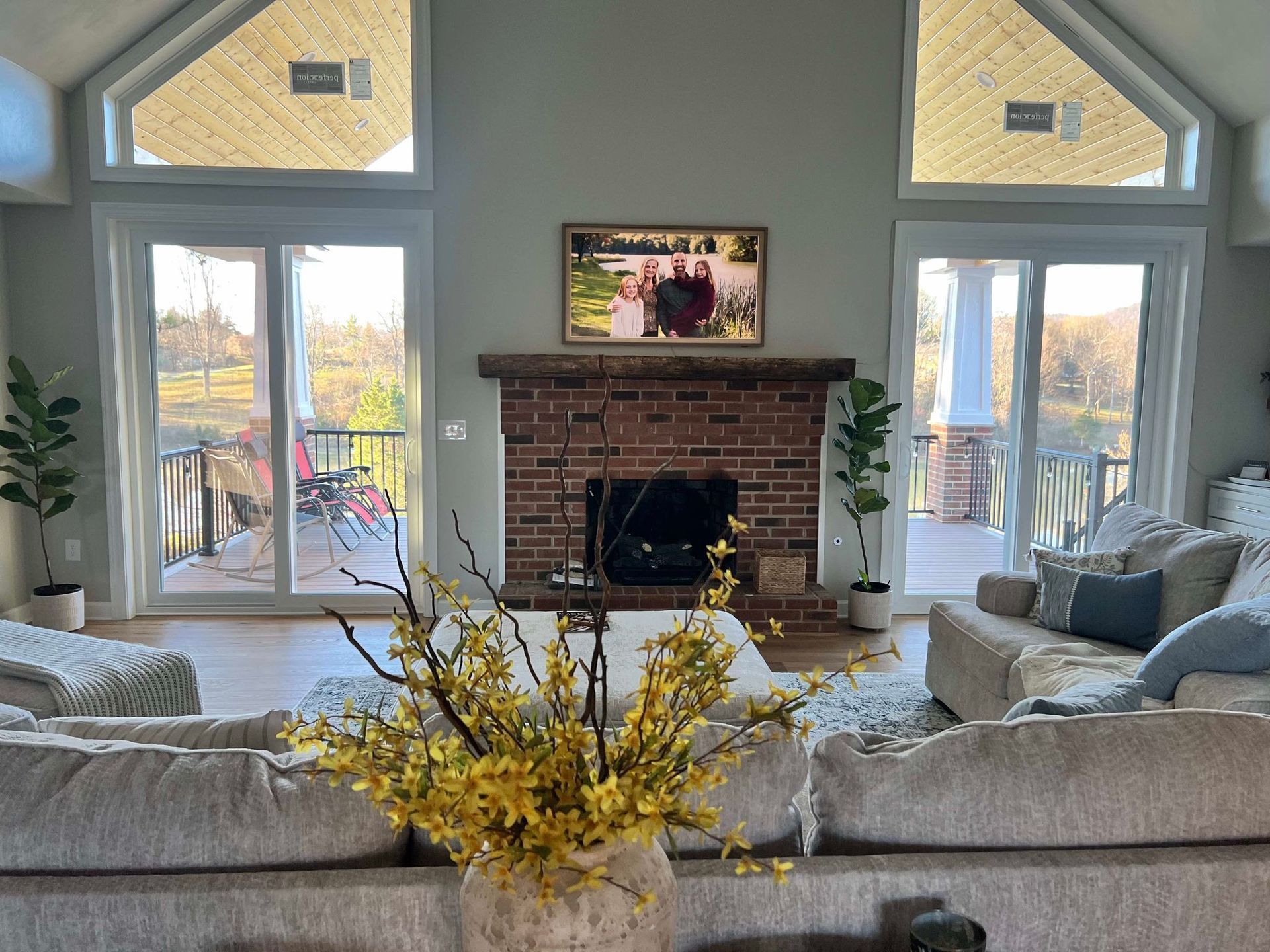 A living room with a fireplace, and couch.