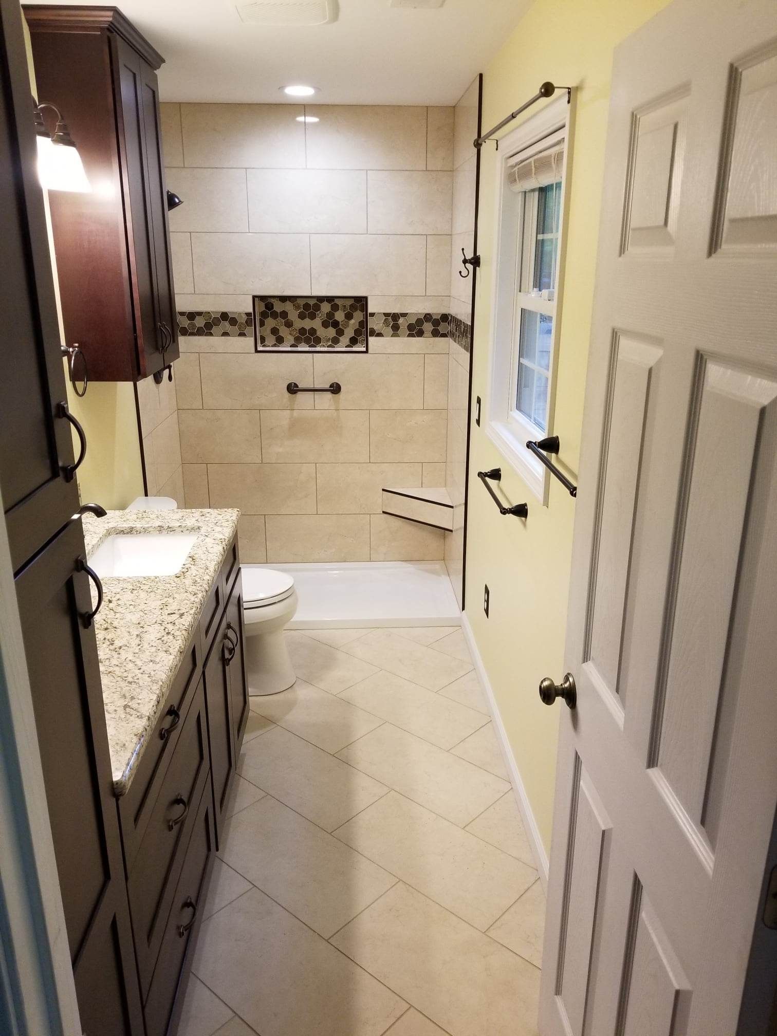 A bathroom with a toilet , sink , and shower.