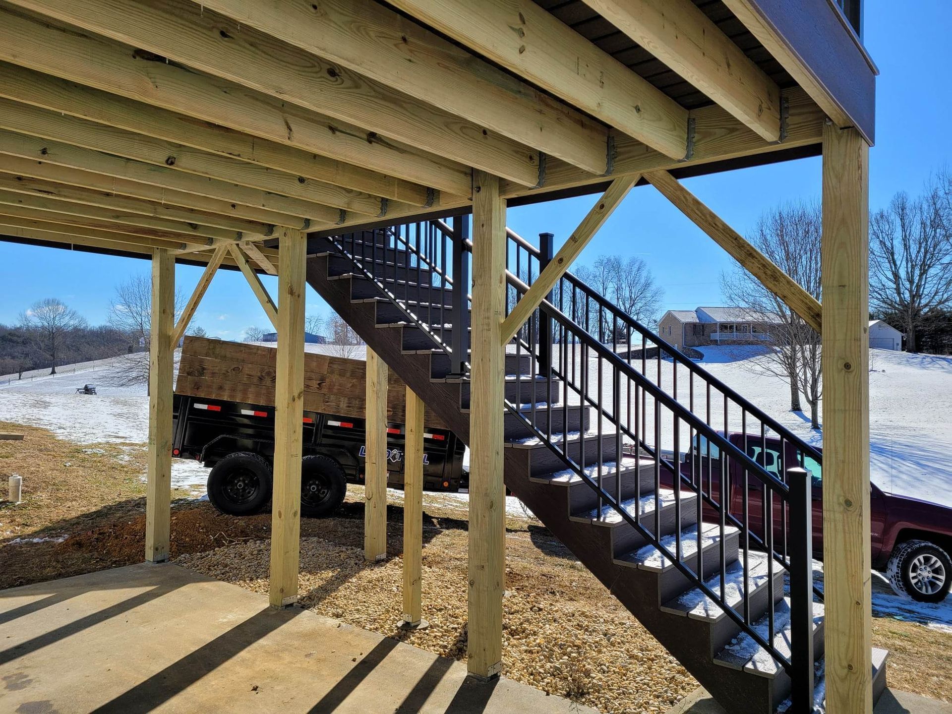 A wooden deck with stairs leading up to it.