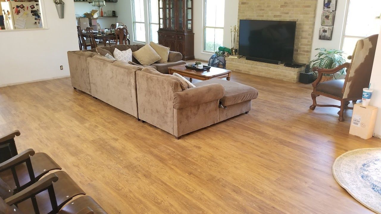 Living room with a sofa and laminate floor