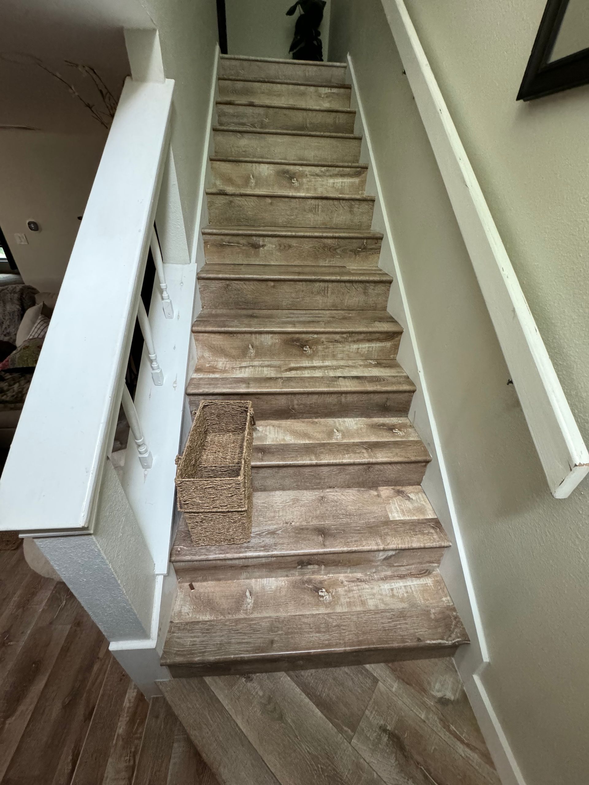 A set of stairs leading up to the second floor of a house.