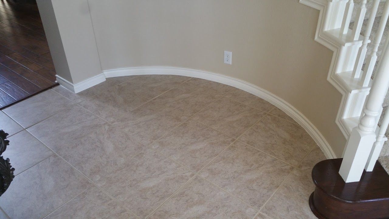 Tiled floor next to a spiral staircase