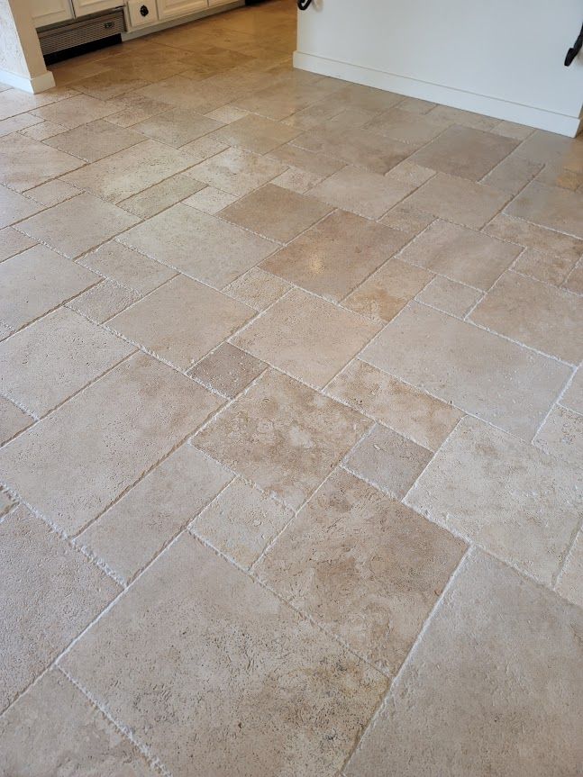 A close-up of a tiled floor in a kitchen