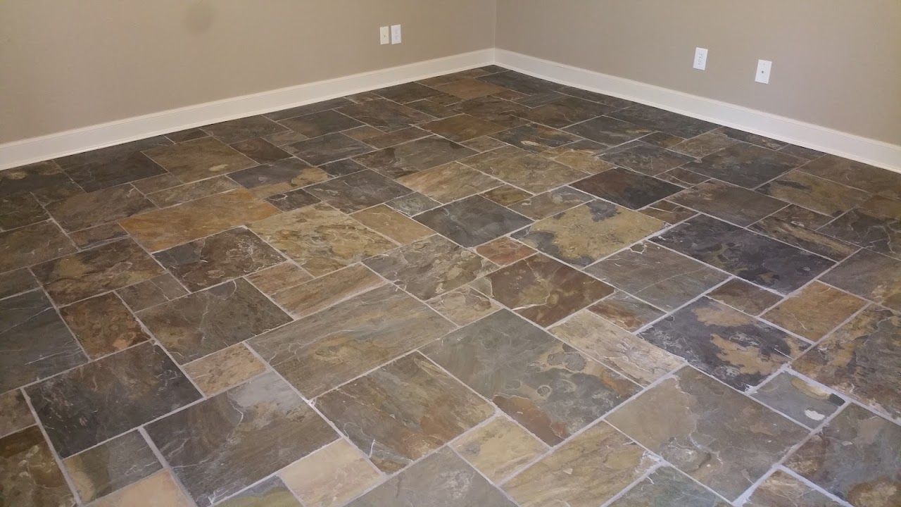 A room with a tiled floor and a wall
