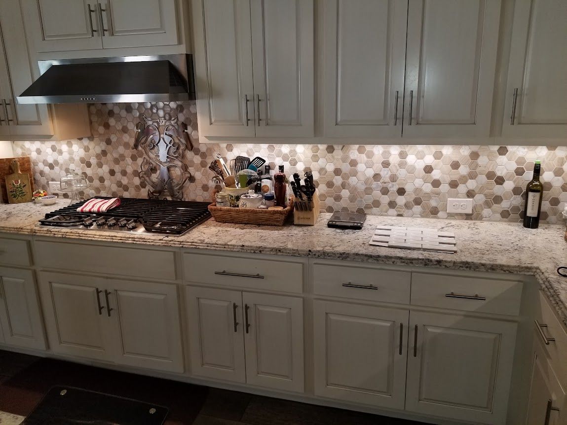 Kitchen with hexagon backsplash tiles