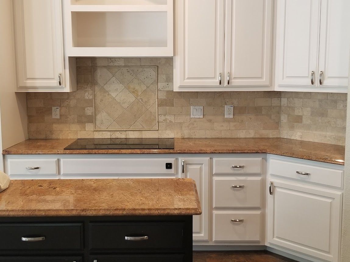 A kitchen with granite countertops