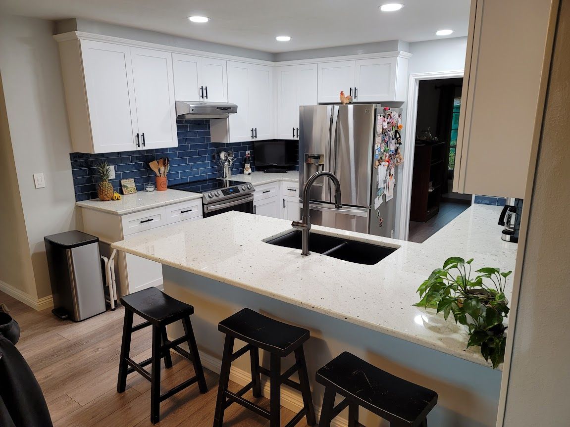 Kitchen with bar stool chairs