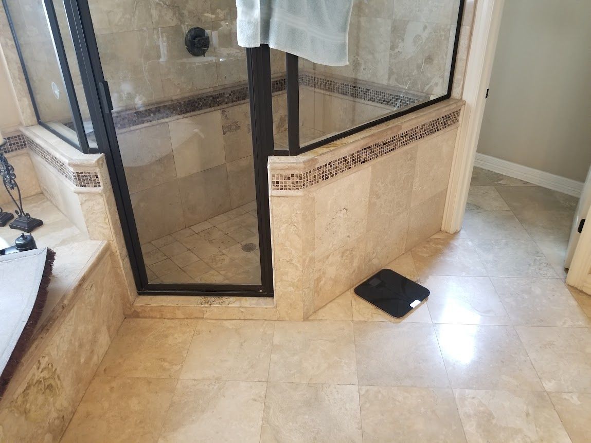 A bathroom with a walk-in shower