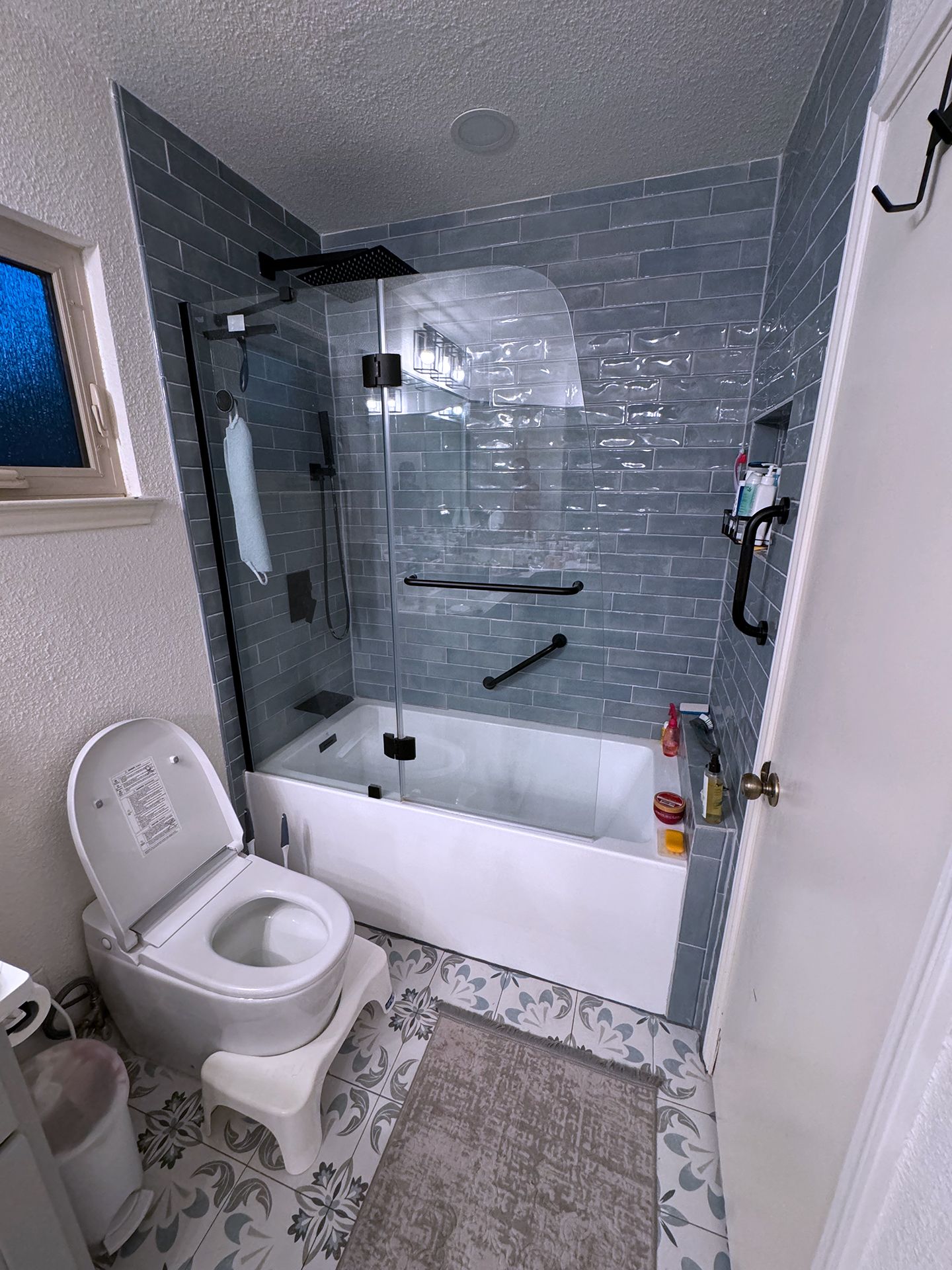 Bathtub with blue wall tiles