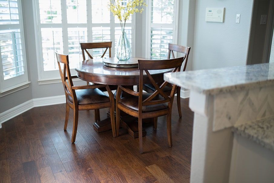 There is a table and chairs in the dining room.