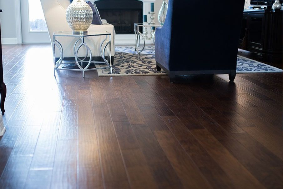 A living room with hardwood floors and a fireplace