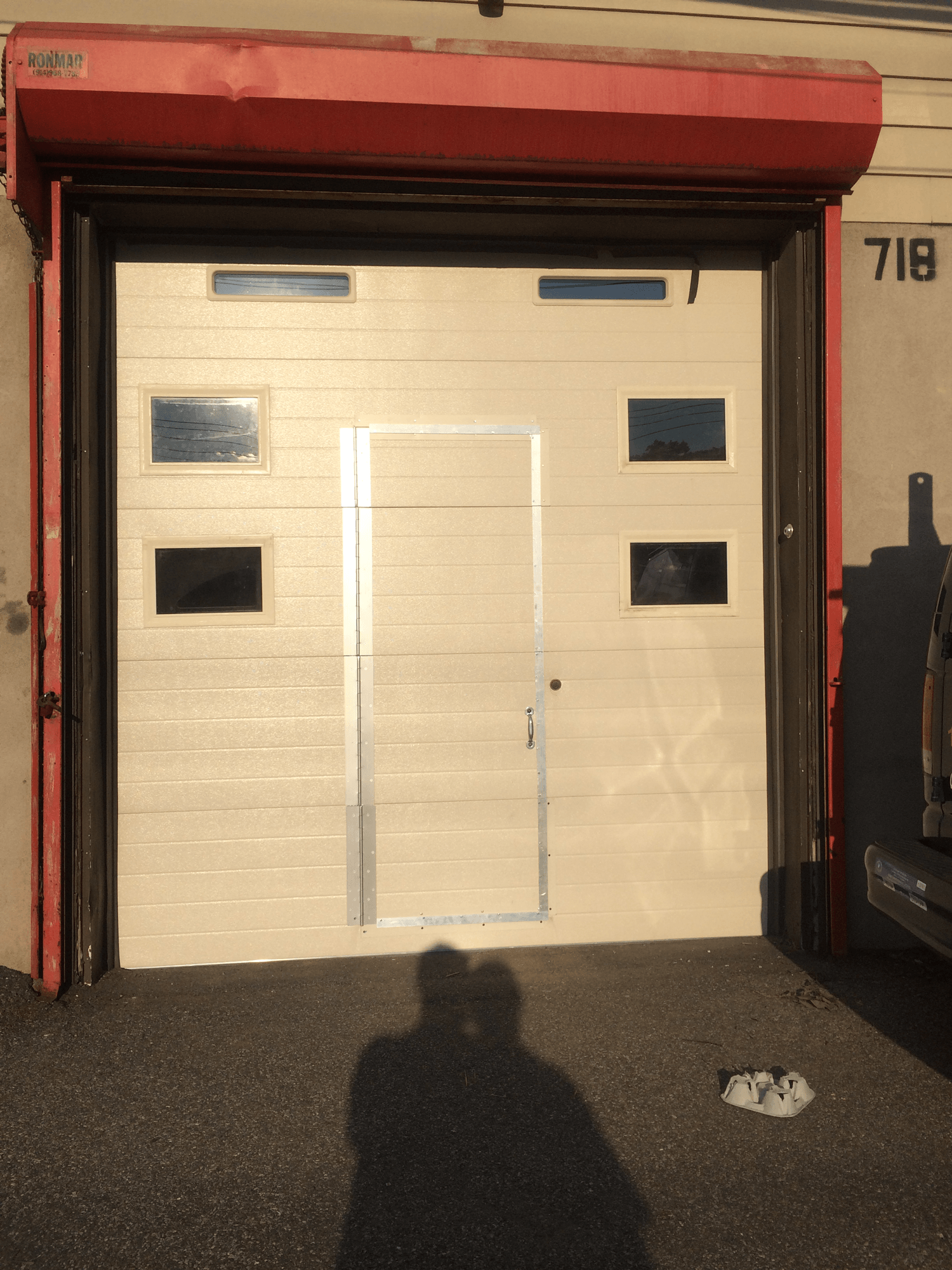 A white garage door with the number 708 on it