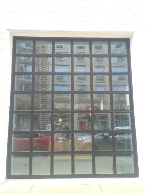 A window with a metal frame and a lot of windows