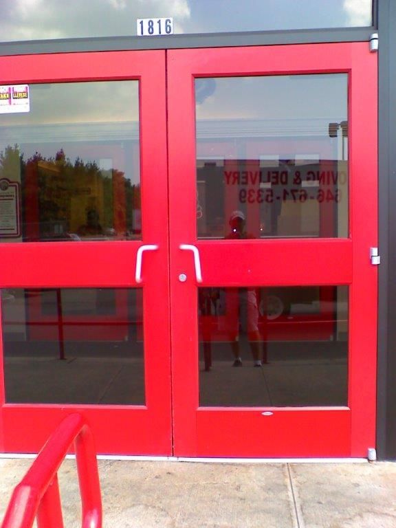 A red door with the number 1816 on it