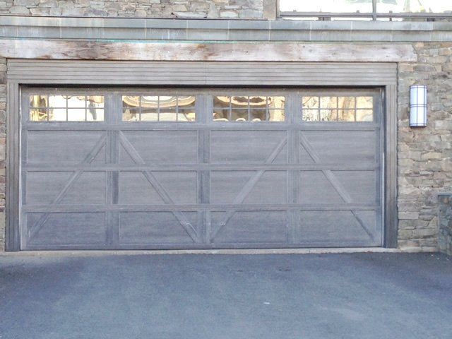 A garage door with a light on the side of it