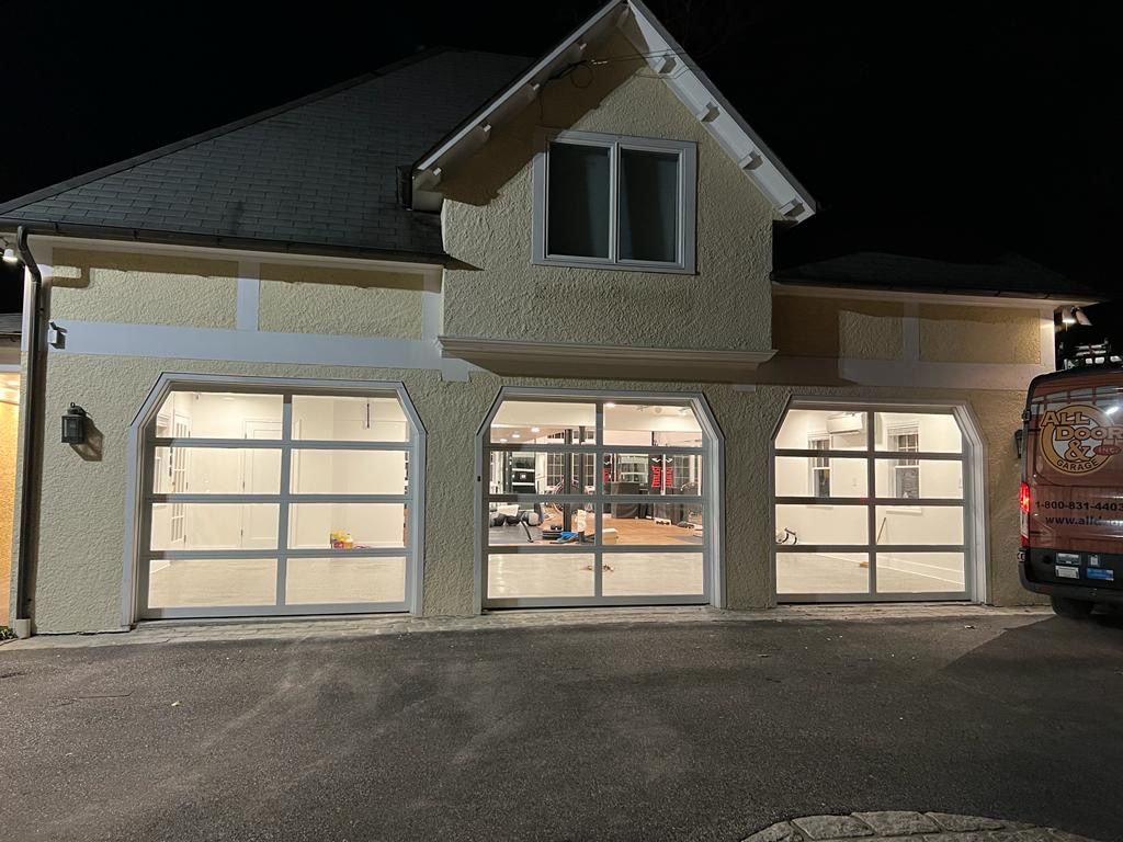 A house with a red van parked in front of it