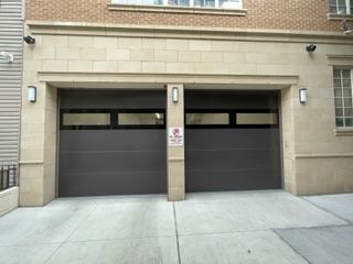 A garage door with a no parking sign on it