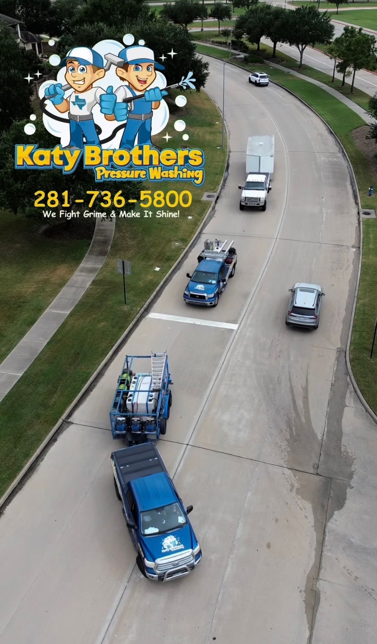 Blue trucks drive on a curving road beside a Katy Brothers towing ad with a phone number.