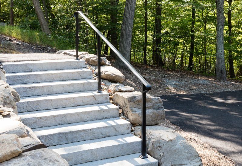 A set of stairs with a metal railing.