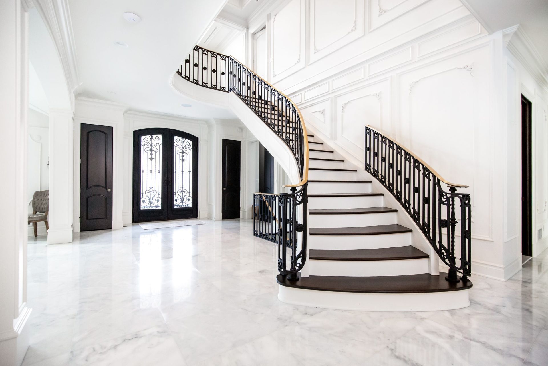 There is a large staircase in the middle of the room.