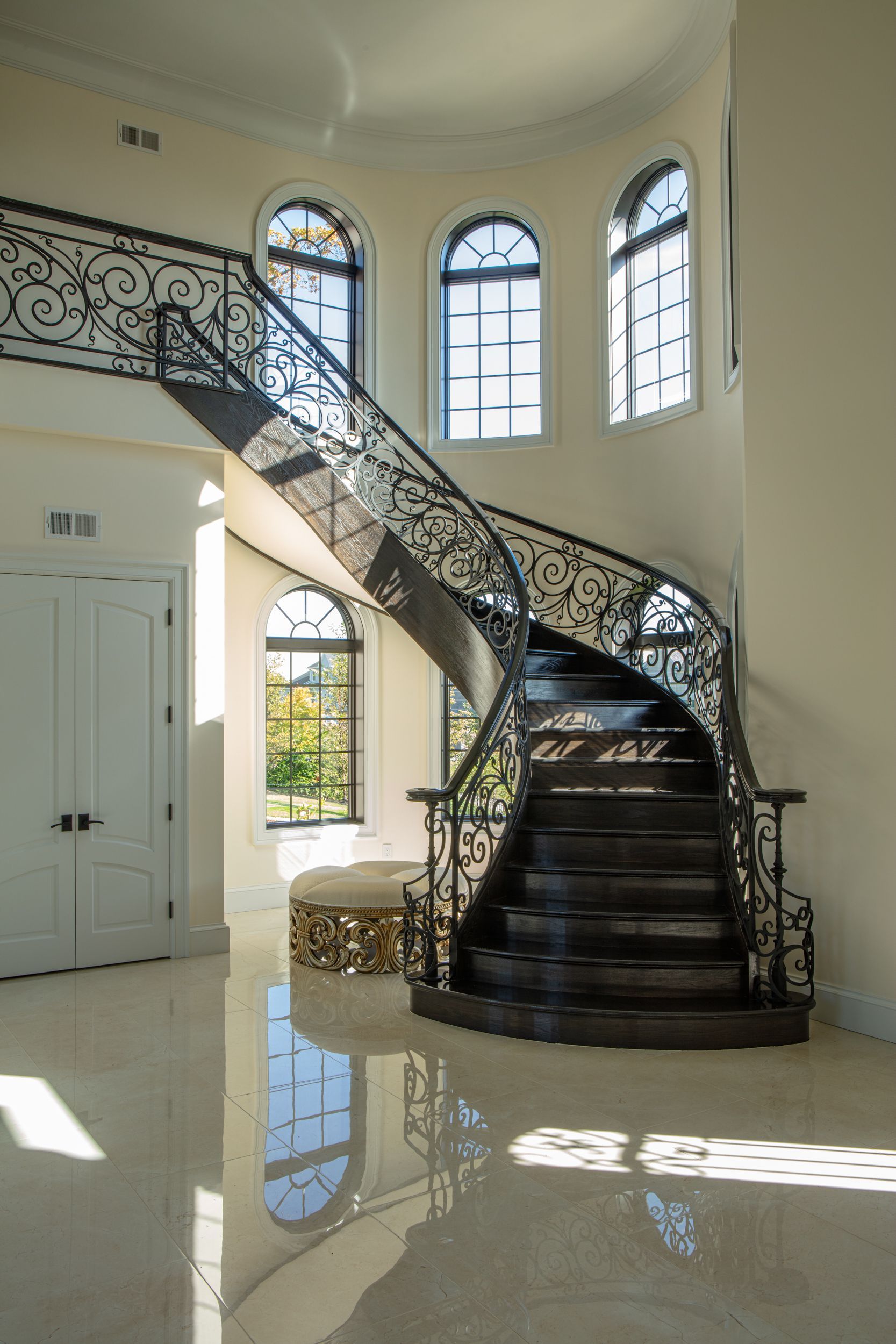 There is a spiral staircase in the middle of the room.