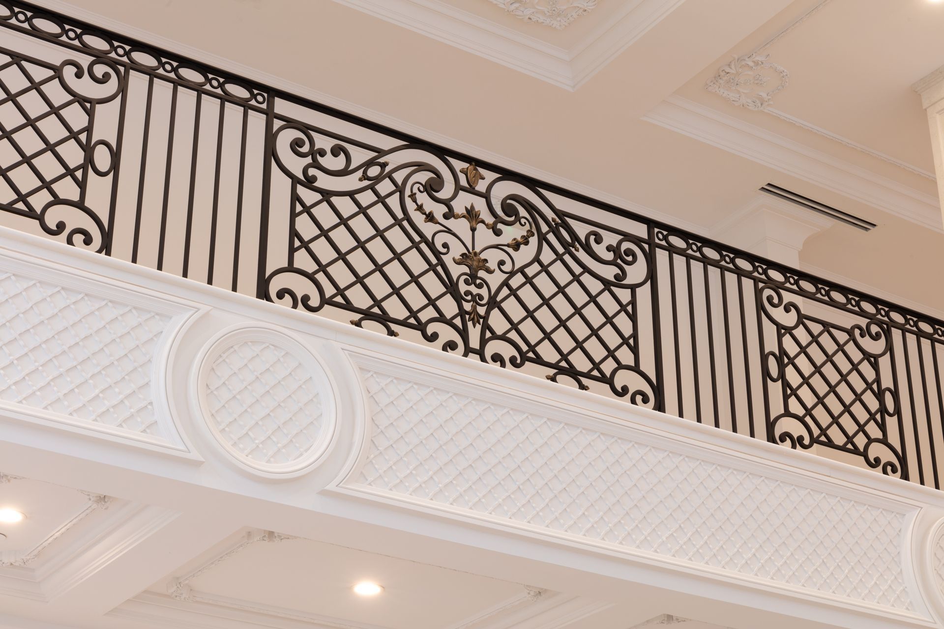 A close up of a wrought iron railing on a staircase.