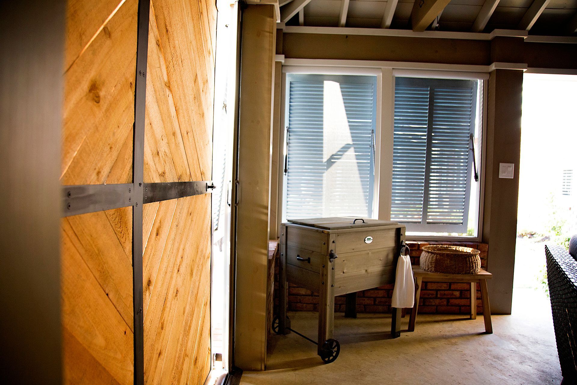 a room with a wooden door and a large window