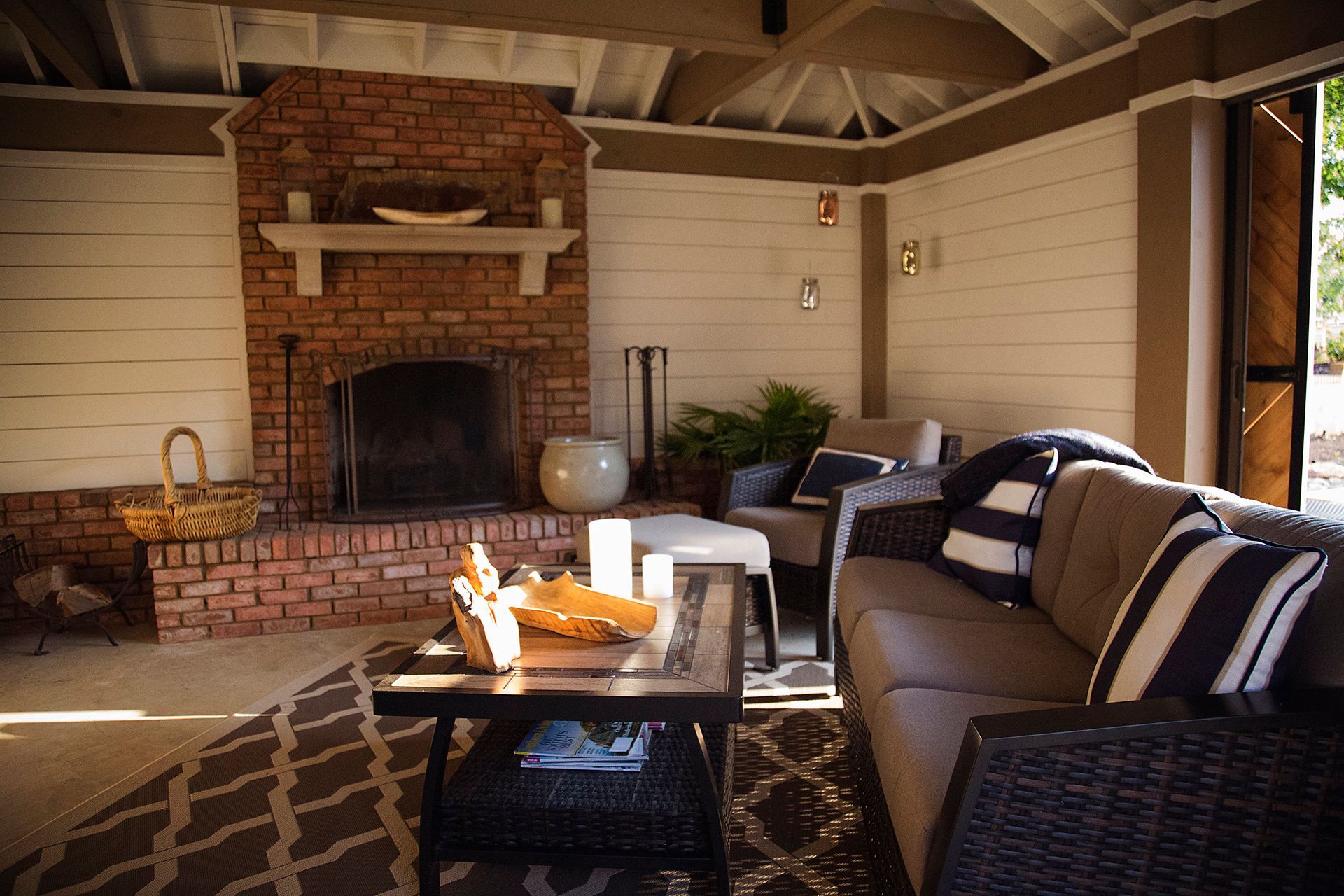 a living room with a fireplace and a couch