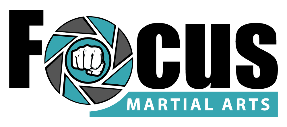 A logo for focus martial arts with a fist in the center.