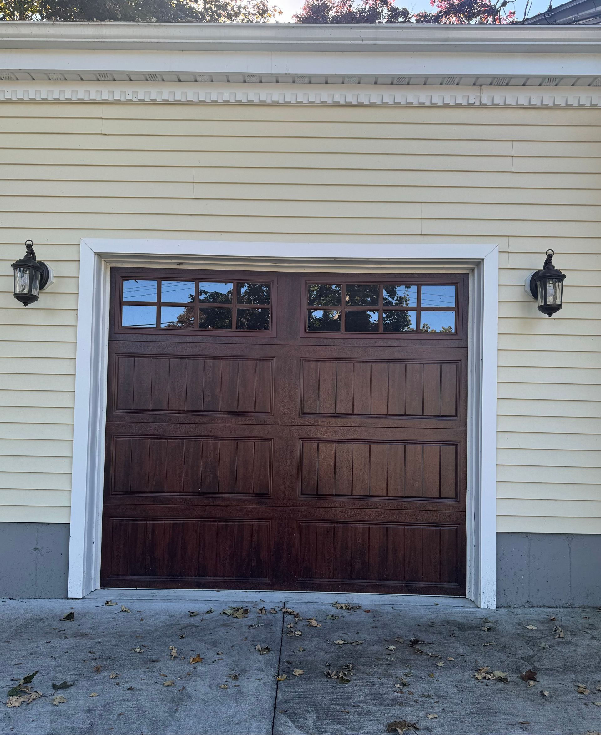 A garage door with a white trim