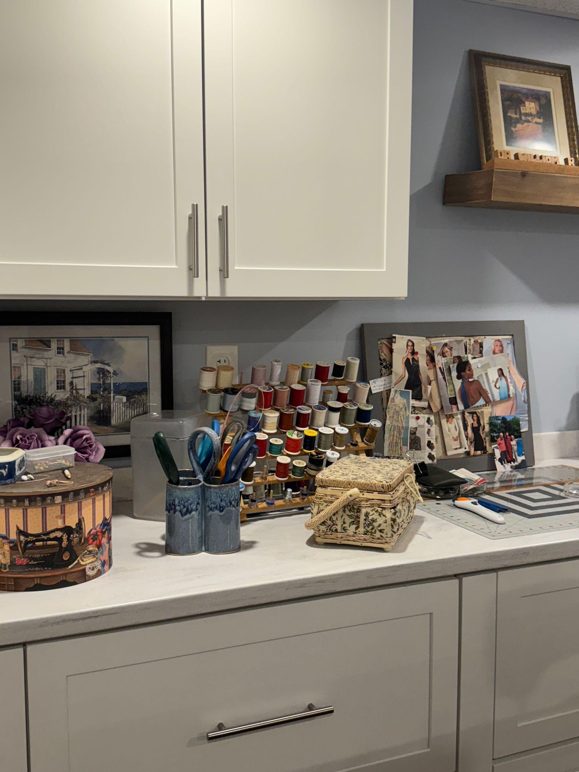 A room with cabinets and a counter with a bunch of supplies on it