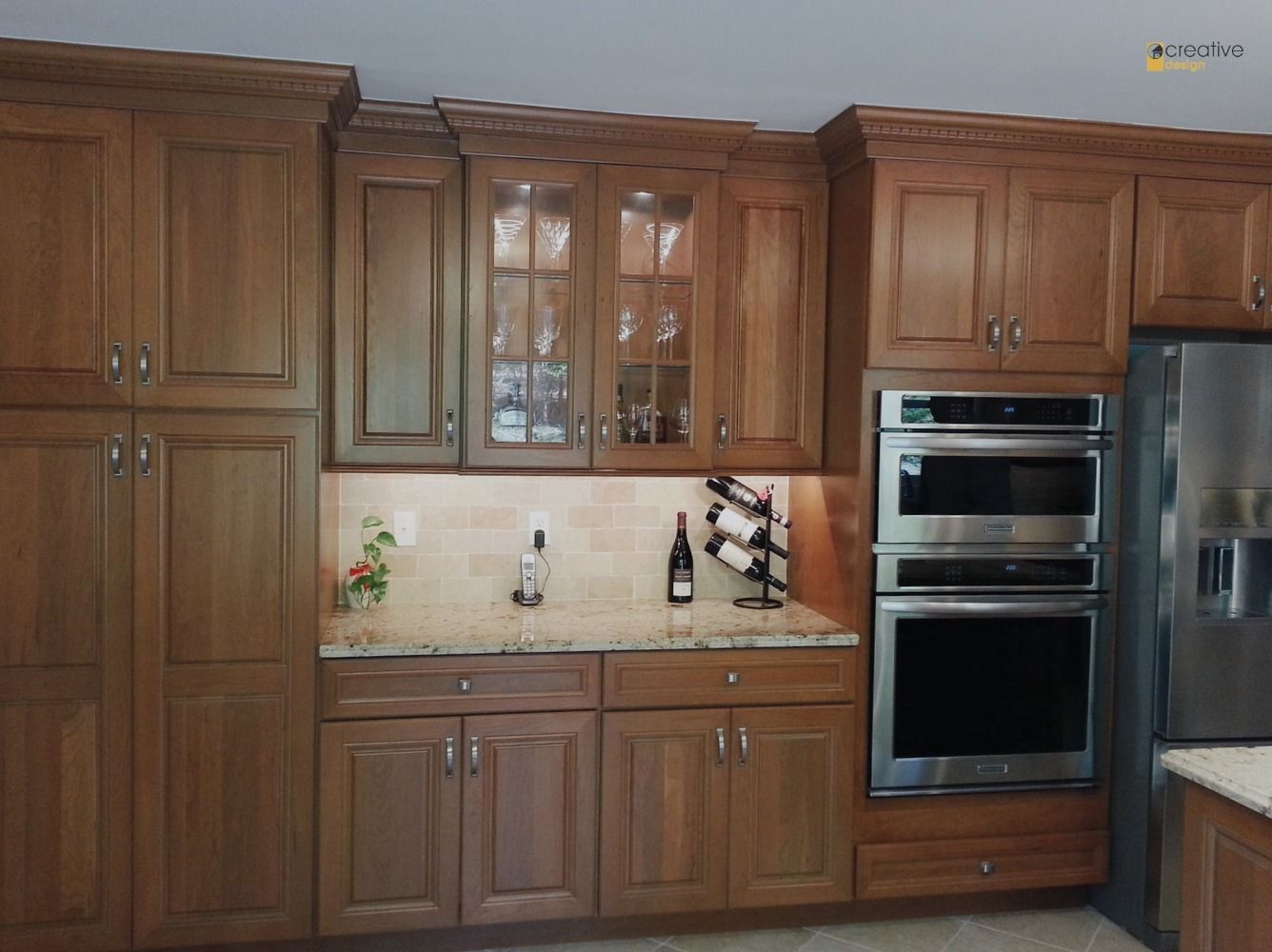 A kitchen with wooden cabinets and stainless steel appliances.
