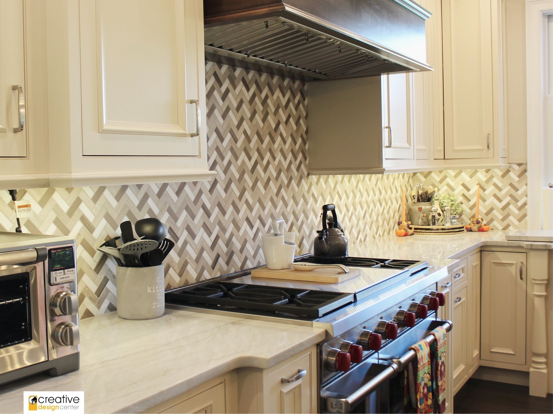 A kitchen with a stove, oven, and microwave.