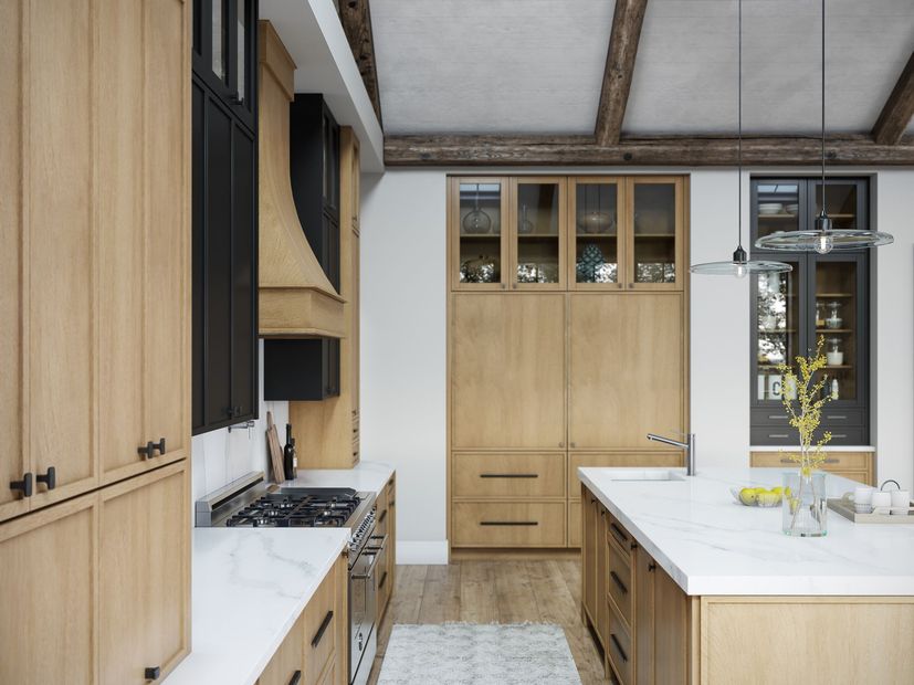 Modern kitchen with wood cabinets, marble countertops, and a black range hood.