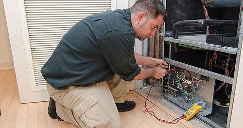 Technician repairing on the heating system