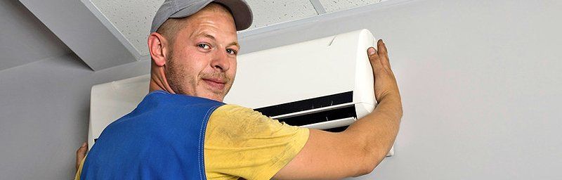 Man installing air conditioner