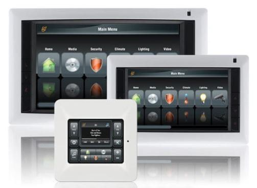 Three remote controls are sitting next to each other on a table