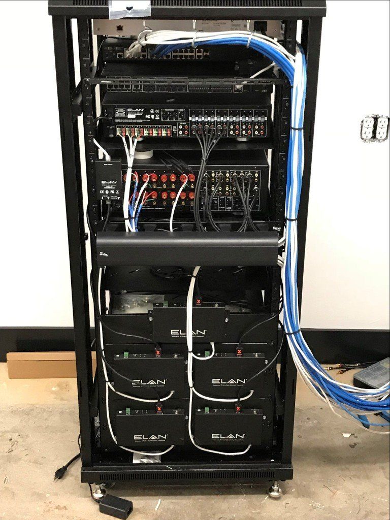 A server rack with a lot of wires coming out of it